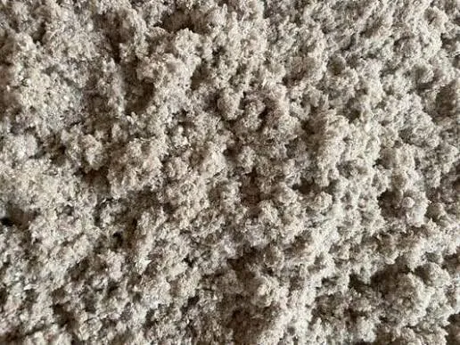 Blown-in cellulose insulation close up